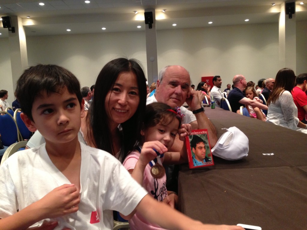 Miguel somewhat disappointed but Mei Jing happy with her prizes among a proud mom and granddad