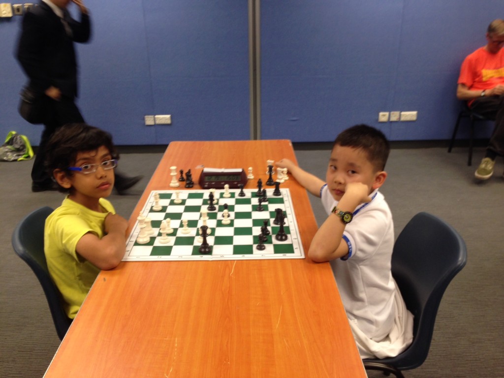 Aaditya was too late to play in the competition but visits each Monday: here practicing with his Caissa buddy Alan