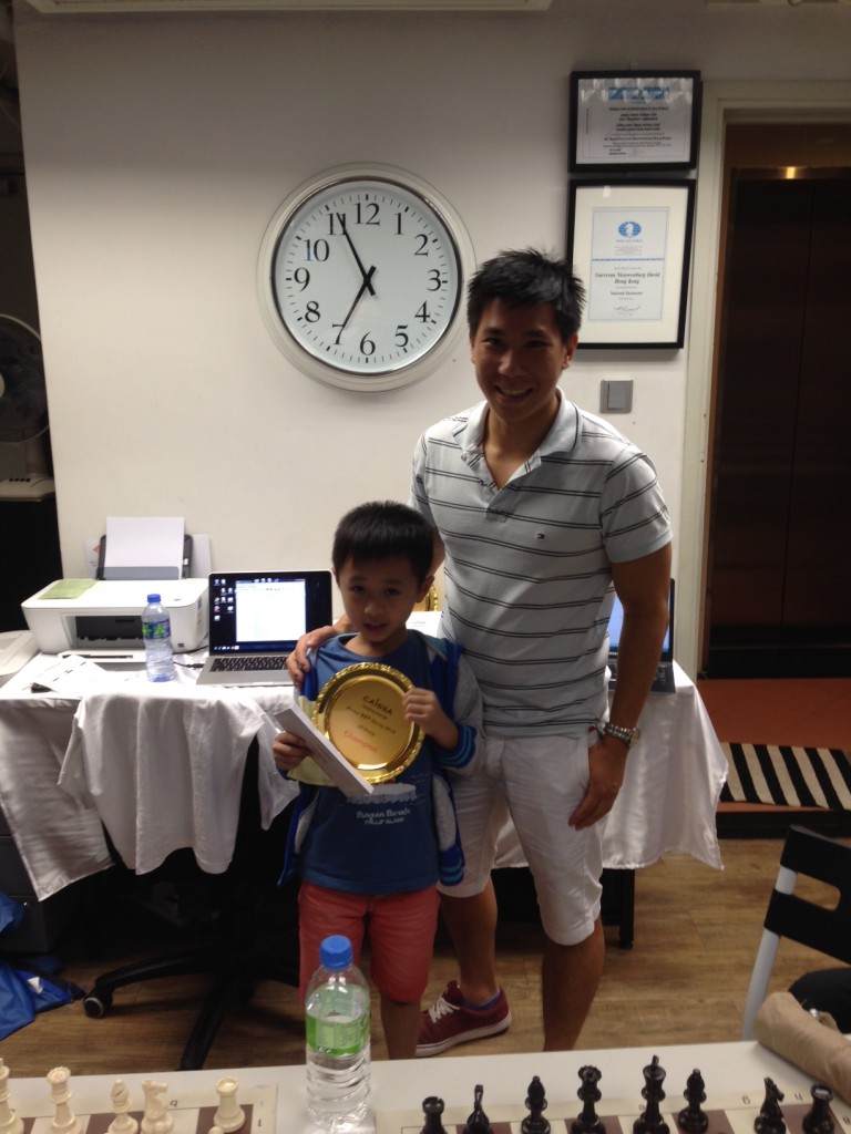 Zeth Champion U8 with coach Matthew Tan